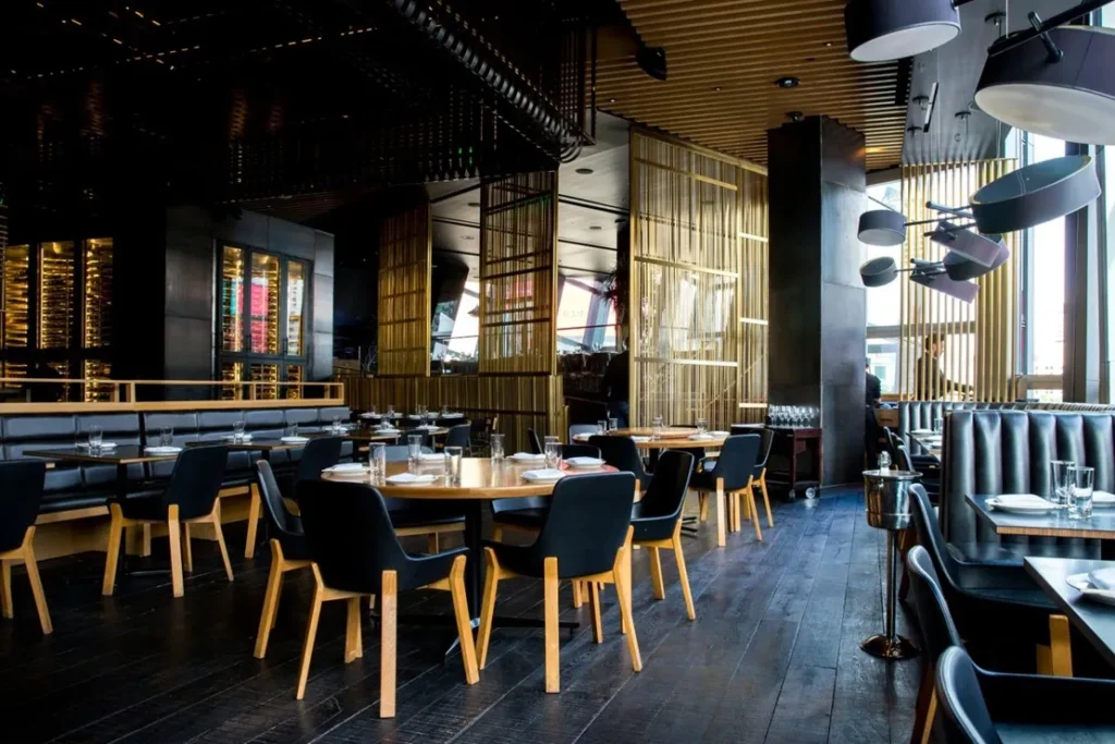 Empty restaurant with butcher block tables.