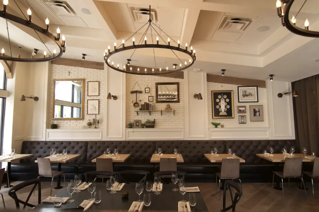 Osprey restaurant interior with wood tables.