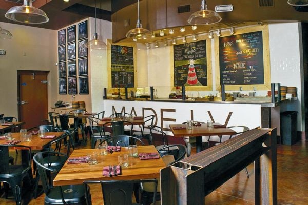 Restaurant tables inside a restaurant located in Las Vegas. The finished product of the Timeworn Process.